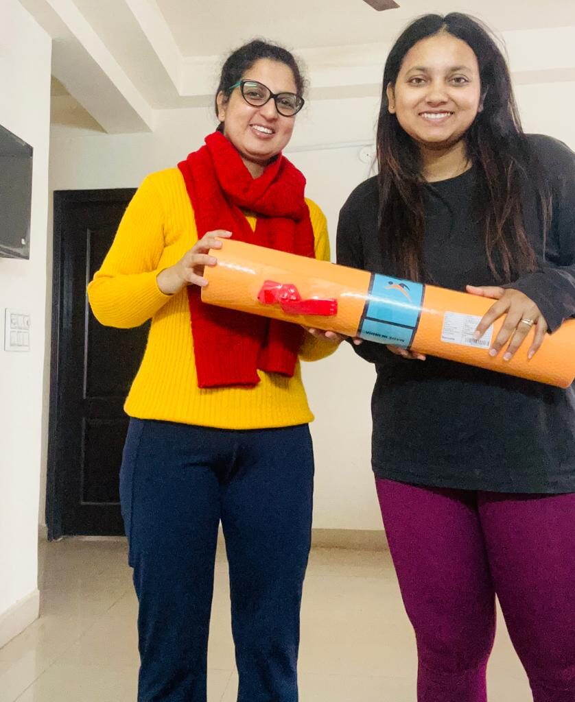 female yoga trainer at home